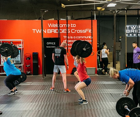 CrossFit athletes participating in a CrossFit workout