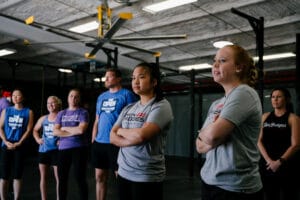 CrossFit athletes prepare for a CrossFit workout